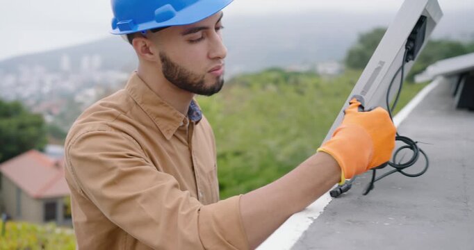 African American crew watching tech in hard hat, gloves checking cable, placing solar panel on roof