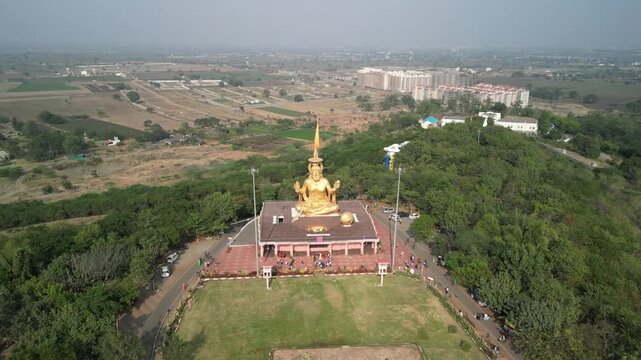 Aerial view of giant golden Hanuman statue at Pitreshwar Dham Indore