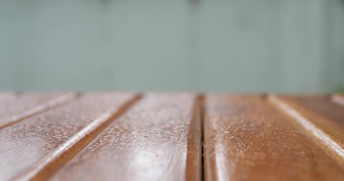 Empty wooden tabletop with blurred neutral grey copy space background