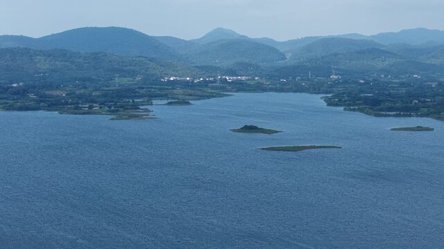Aerial View of Huiting Reservoir and Distant Mountains, Jingshan, Hubei, China