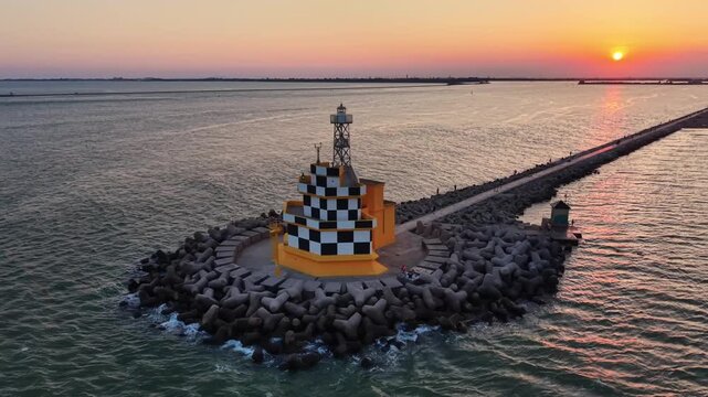 Punta Sabbioni Lighthouse at Sunset on the Adriatic Coast in Italy