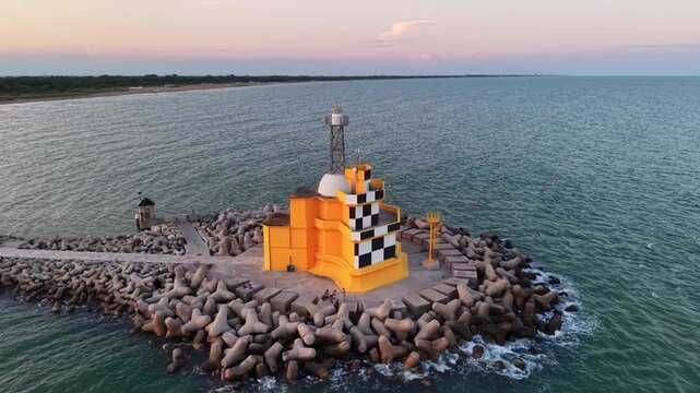 Punta Sabbioni Lighthouse at Sunset on the Adriatic Coast in Italy