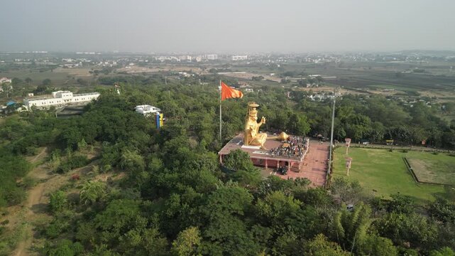 Aerial footage orbiting left to front of Pitra Parvat Hanuman
