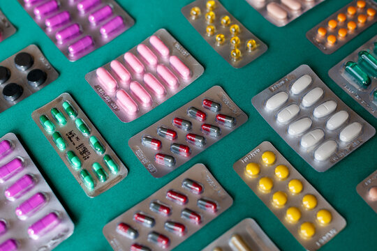 Colorful blister packs on table.