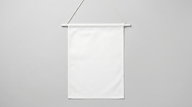 Blank White Fabric Banner Hanging on a Wooden Dowel Against a Neutral Gray Background
