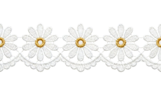 White daisy lace trim with gold centers isolated on a black background for sewing and craft projects