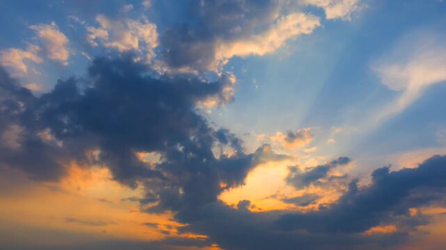 Sunrise time lapse with rays appearing through morning clouds