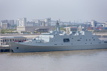 Chinese Navy warship moored at a riverside quay on the Yangtze River near Shanghai, China. © Mariusz