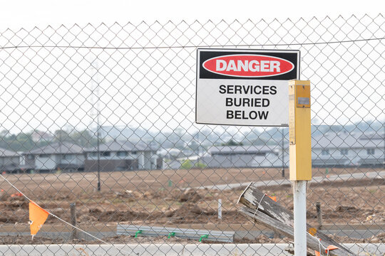 Danger Sign Warning of Buried Services at Residential Site