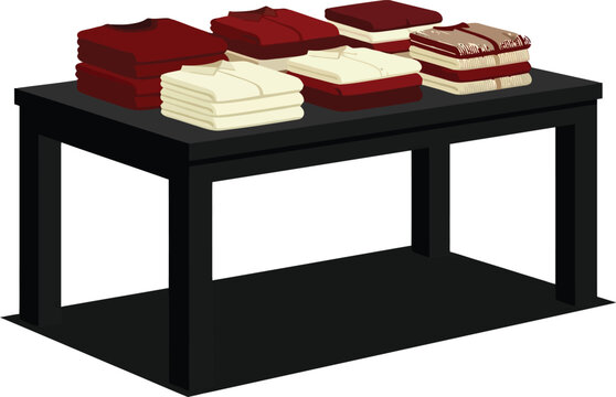 A black retail display table featuring stacks of folded clothing items.
