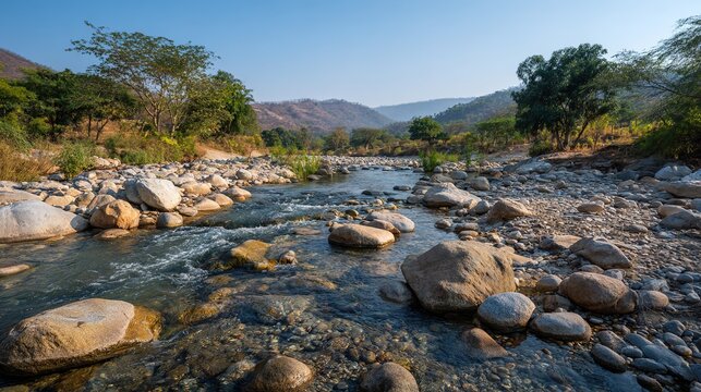 silt. Dry riverbed refilled with clear flowing water, sunlight glinting on surface. ESG reports, sustainability campaigns, designed for environmental awareness campaigns, used by PR specialists.