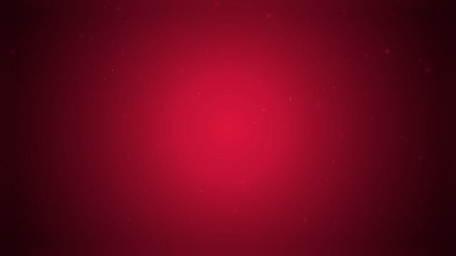 Elegant red background loop featuring floating bokeh particles glowing from a bright radial center light, creating a romantic festive atmosphere for holiday celebration video composition.