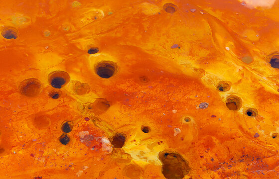 Holes on the bottom of the Geamăna tailings pond, the result of violent chemical and physical processes, specific to acid mine drainage. Gas release, chemical effervescence due to mining waste