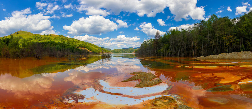 Landscape with the Geamana tailings pond (Sesii Valley), Alba County - Romania. Geamana tailings pond in the Apuseni Mountains. Ecological disaster, lake with toxic water, polluted with chemicals