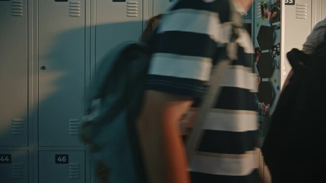 Teenage Girl Leaning Against Lockers, Struggling to Breathe and Experiencing Anxiety Episode During School Break. Concept of Adolescent Isolation, Mental Health Issues, Social Indifference. Portrait.
