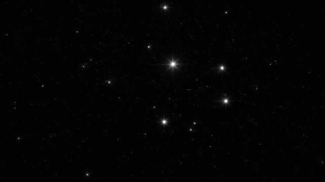 Bright stars scattered across a dark night sky with sparkling effects