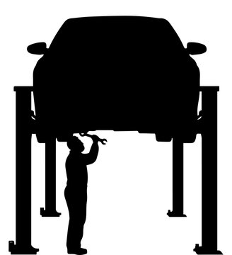 Silhouette of a Mechanic Repairing a Car on a Hydraulic Lift in an Auto Service Garage