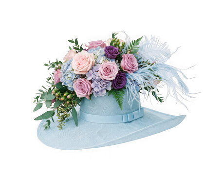 Elegant light blue ladies hat decorated with flowers and feathers isolated on transparent background