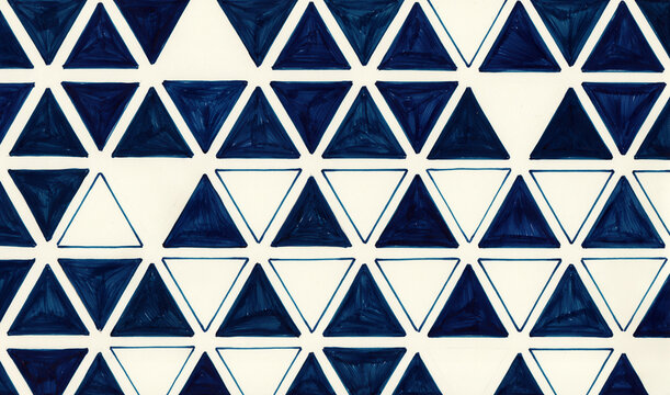 Geometric Pattern Featuring Blue Triangles Arranged On White Background