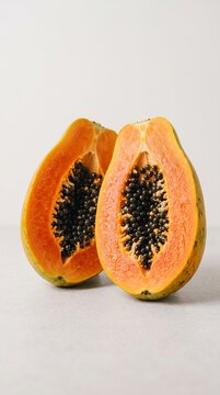 Fresh ripe papaya with vibrant orange flesh and black seeds