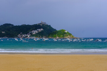 Fototapeta premium La Concha Beach and Bay with Santa Clara Island and Mount Igueldo in San Sebastian, Basque Country, Spain