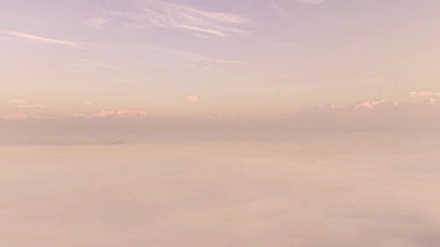 Himalayan peaks and isolated hill above sea of clouds in Nepal