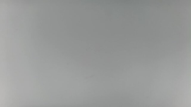 Simple abstract metallic grey colour background for graphic design use. Gray color polished and shiny silver, aluminium or steel metal surface texture.
