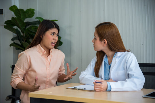 Doctor talking to patient support giving hope listening takecare for mental health therapy. Woman doctor holding hands patient encourage cheer up consultation at hospital medicare treatment clinic