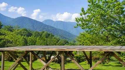Fototapeta premium Panoromic daytime view of lush green mountain forest from outdoor wooden balcony deck 