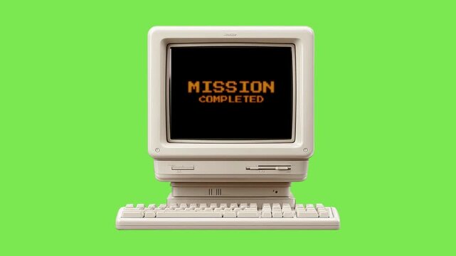 A classic retro computer screen displays 'MISSION COMPLETED', symbolizing successful task completion and a bygone era of computing achievement