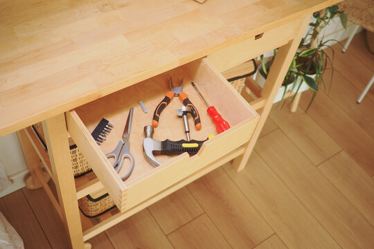 Tools are organized in a drawer in a workshop