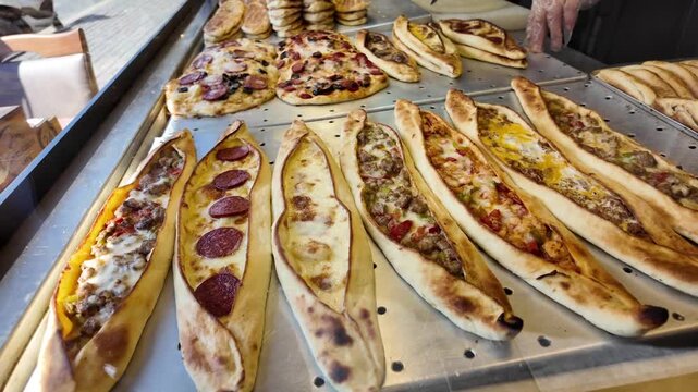 Fresh pide and baked goods on display in a cafe