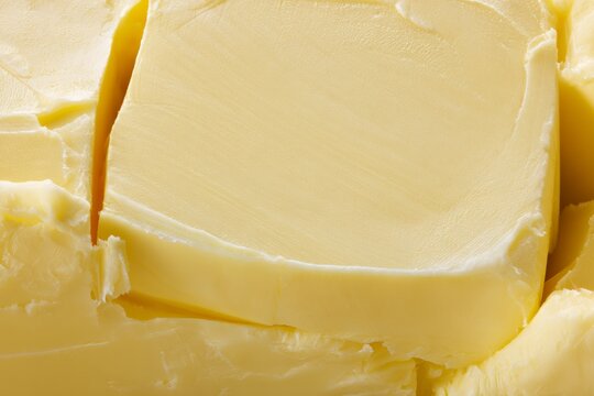 Butter blocks stacked close together in a kitchen setting showing smooth surface