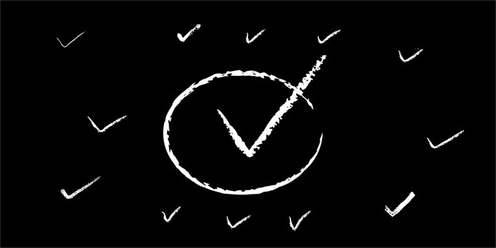 Hand drawn white chalk check marks on a black background representing success and task completion