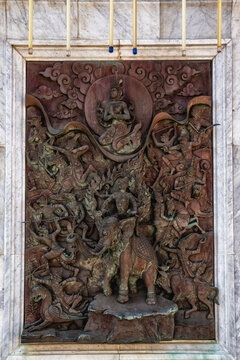 Intricate wall art details at Wat Traimit temple, Bangkok, Thailand