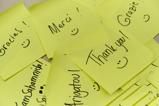 Thank you concept written in different languages on yellow sticky notes