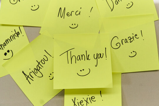 Thank you concept written in different languages on yellow sticky notes