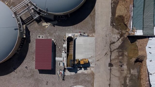 Tractor Loading Silage at a Biomethane Plant, Sustainable Agriculture in Italy