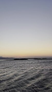 Serene Sunset Over Calm Coastal Waters