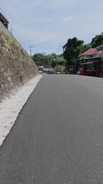 Paved Road Through a Rural Village