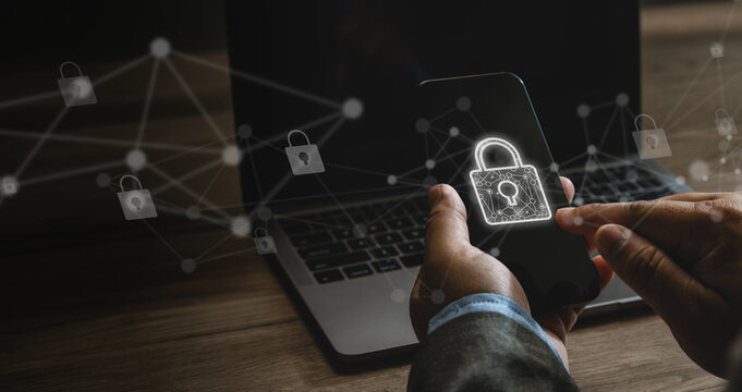 Businessman using a smartphone with padlock and network cybersecurity, internet privacy, antivirus protection and secure data across connected devices cyber attack, user private data