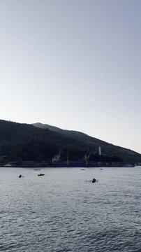 Fishing Boats Near Coastal Mountain and Harbor