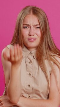 Face palm. Shame on you. Upset Caucasian young woman making face palm gesture, feeling bored, disappointed in result, bad news, sorrowful. Unhappy lady isolated on pink studio background indoors