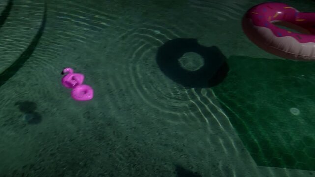 Calm dusk aquatic setting featuring colorful inflatables and gentle ripples