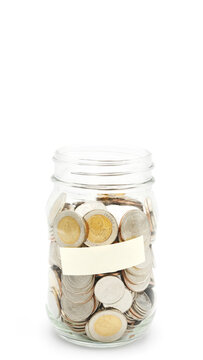 Glass jar full of Thai baht coins. Business and finance concept. Vertical Photography.
