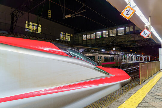 A Shinkansen train at the platform of Akita Station at night on April 4, 2021 in Akita, Japan.