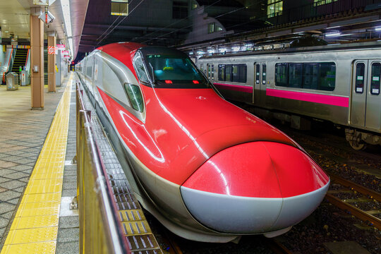 The front of a JR East E6 series Akita Shinkansen 'Komachi' at the platform of Akita Station at night on April 4, 2021 in Akita, Japan.