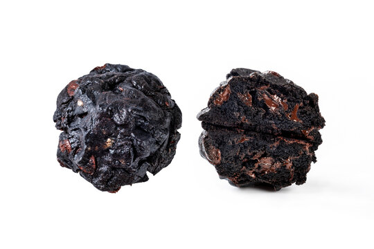 Two pieces of double chocolate; one piece is visible on top, and the other is broken and stacked to reveal the filling inside. Image on white background.