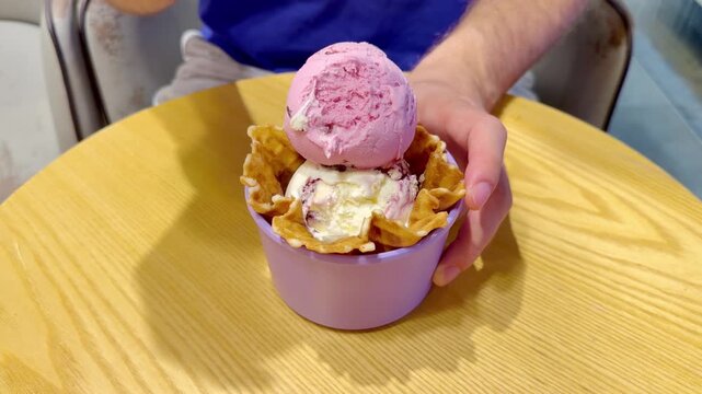 Close Up of Ice Cream Scoop in Bowl with Hand Holding Spoon ,Sweet Dessert