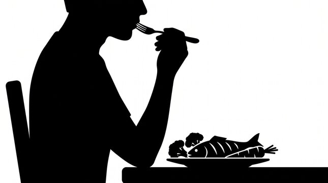 Black silhouette of a person eating fish and vegetables at a table with broccoli